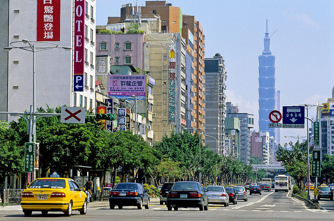 Street and traffic with Taipei 101 tower in background. Taipei. Taiwan