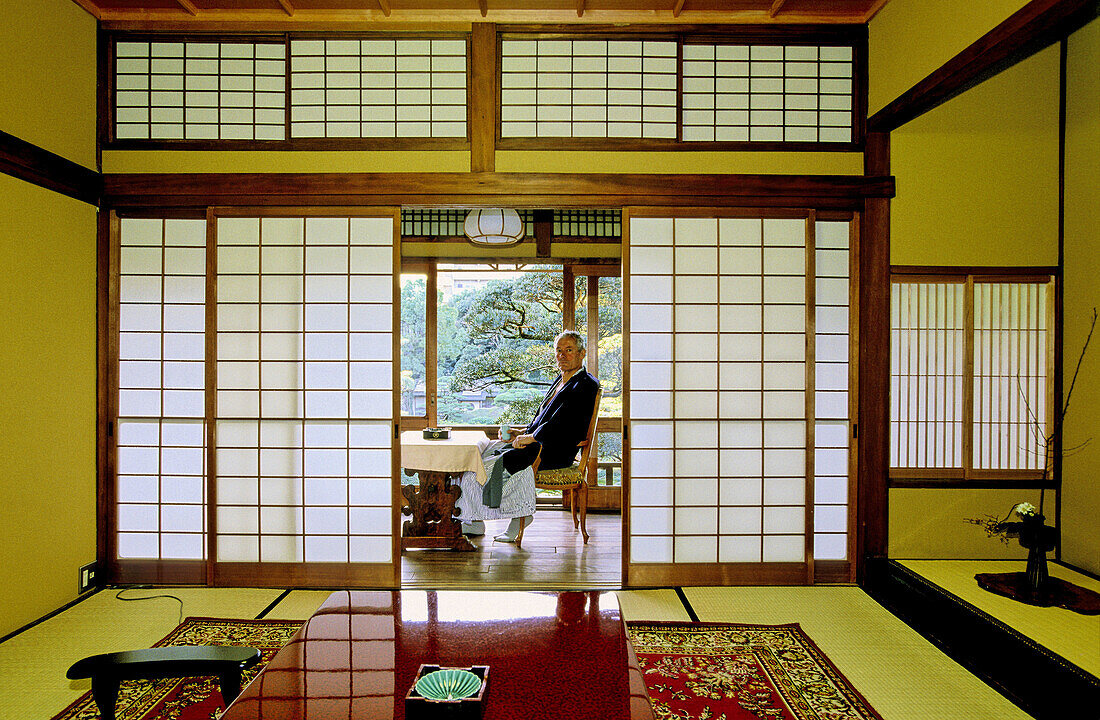 European visitor in a traditional riokan (ancient inn). City of Fukuoka. Kyushu Island. Japan.