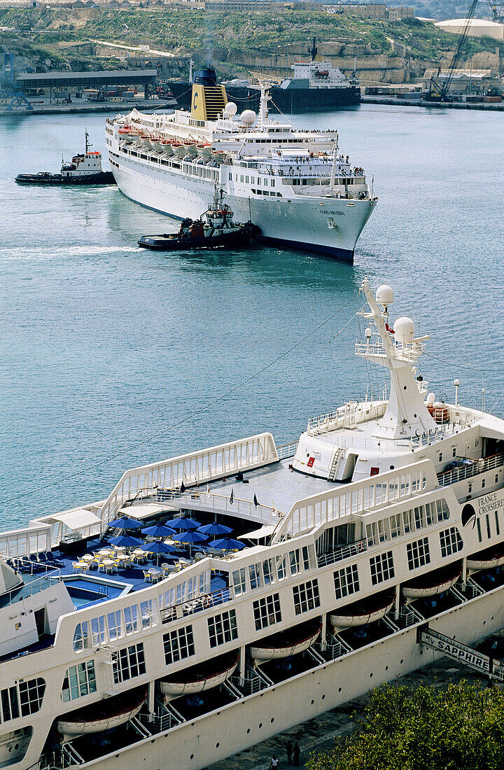Liners manoeuvring in Grand Harbour. Malta.