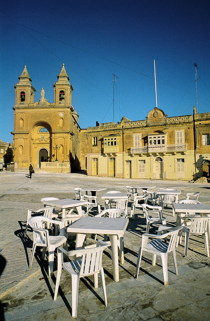 Café terrace on the Church Square. Marsaxlokk. Malta.