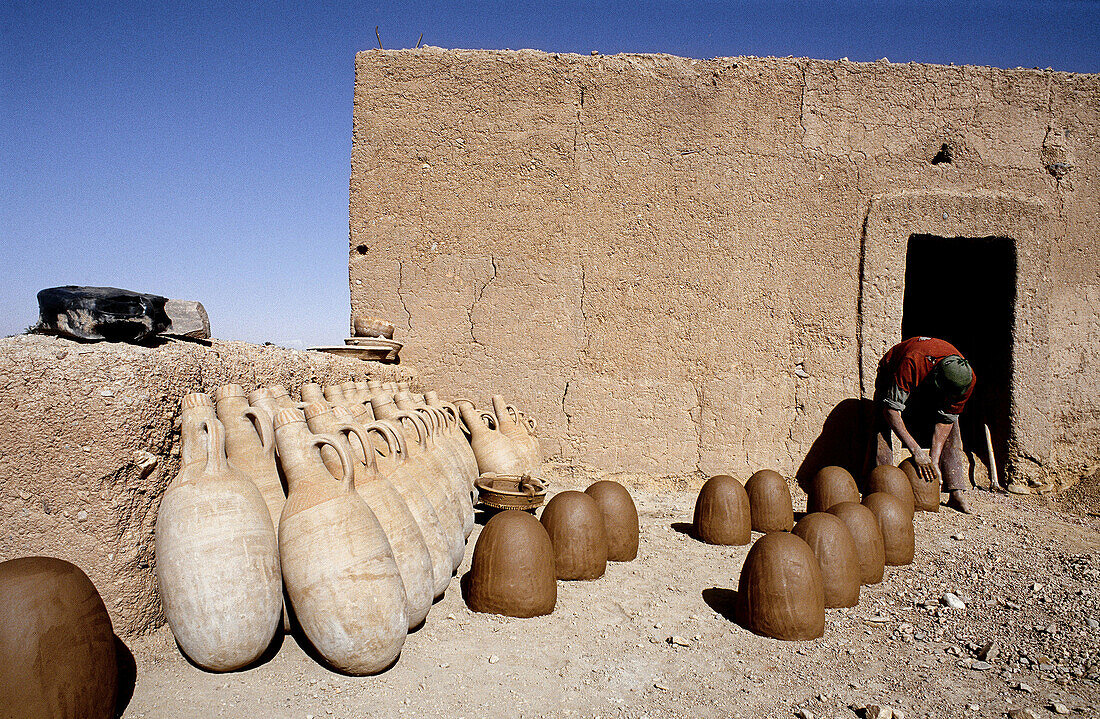 Potter at work. South, Ouarzazate region. Morocco.