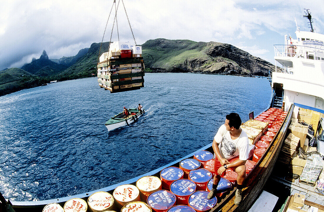 Freighter and liner Aranui cruise in Hakahau Bay. Ua-Pou island. Marquesas archipelago. French Polynesia