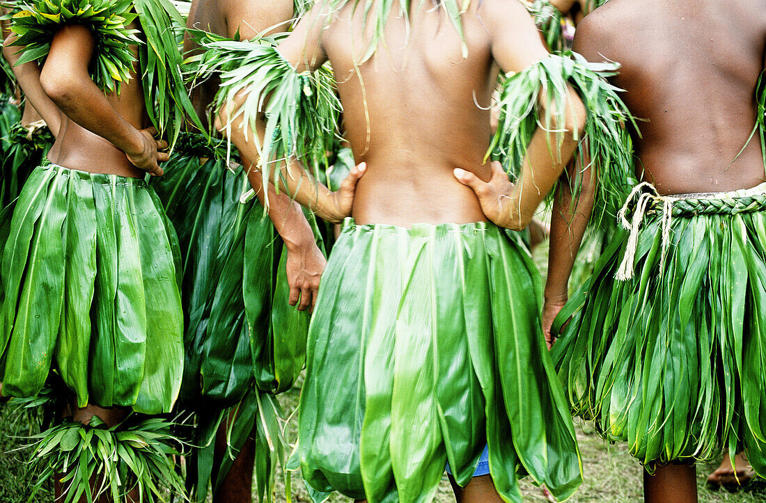 Boys dressed with vegetal leaves for traditionnal dances. The Evangile yearly festival in Tahiti Windward islands. Society archipelago. French Polynesia