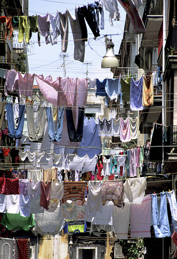 Hanging laundry in street at Spaccanápoli ( Split of Naples ) area, old town. Naples. Italy