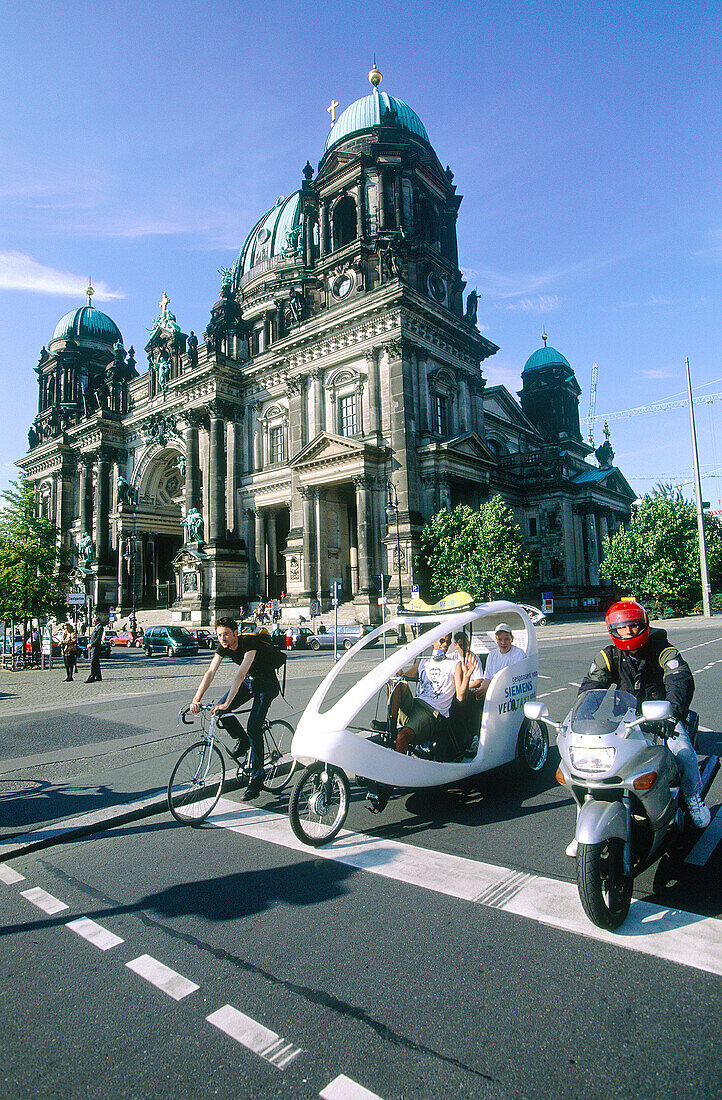 Cathedral. Bike, motorcycle and pedicab. Berlin. Germany