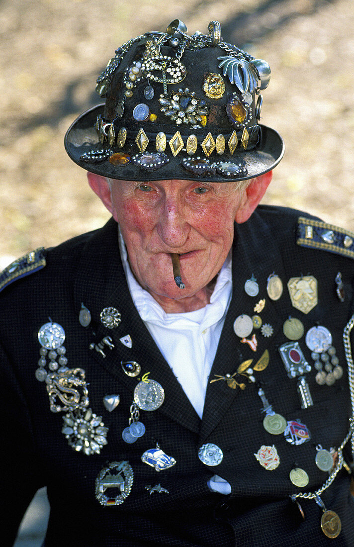 Senior citizen with a suit full of decorations and medals. Berlin. Germany
