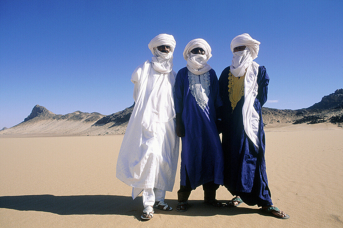 Three tuareg brothers in the Djanet Oasis. Tassili n Ajjer desert. Sahara. South Algeria
