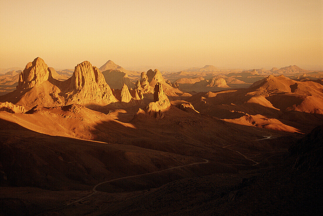 Atakor Mountains seen from father Charles de Foucault ermitage at sunset. Assekrem col. Hoggar, Sahara desert. Algeria