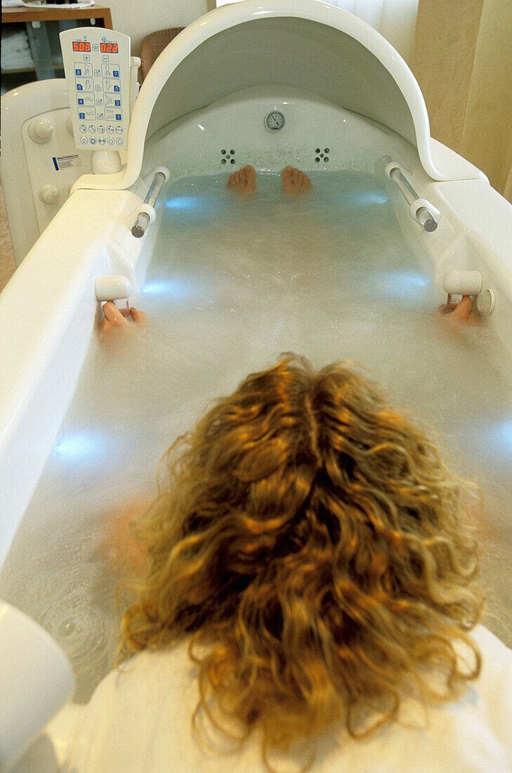 Hotel spa. Woman relaxing in a whirlpool. Tyrol. Austria