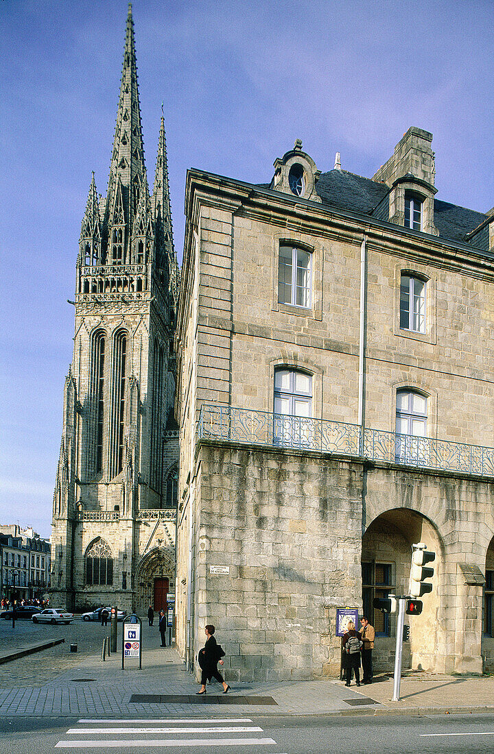 Classical stone building and cathedral in background. Quimper. Finistere. Brittany. France