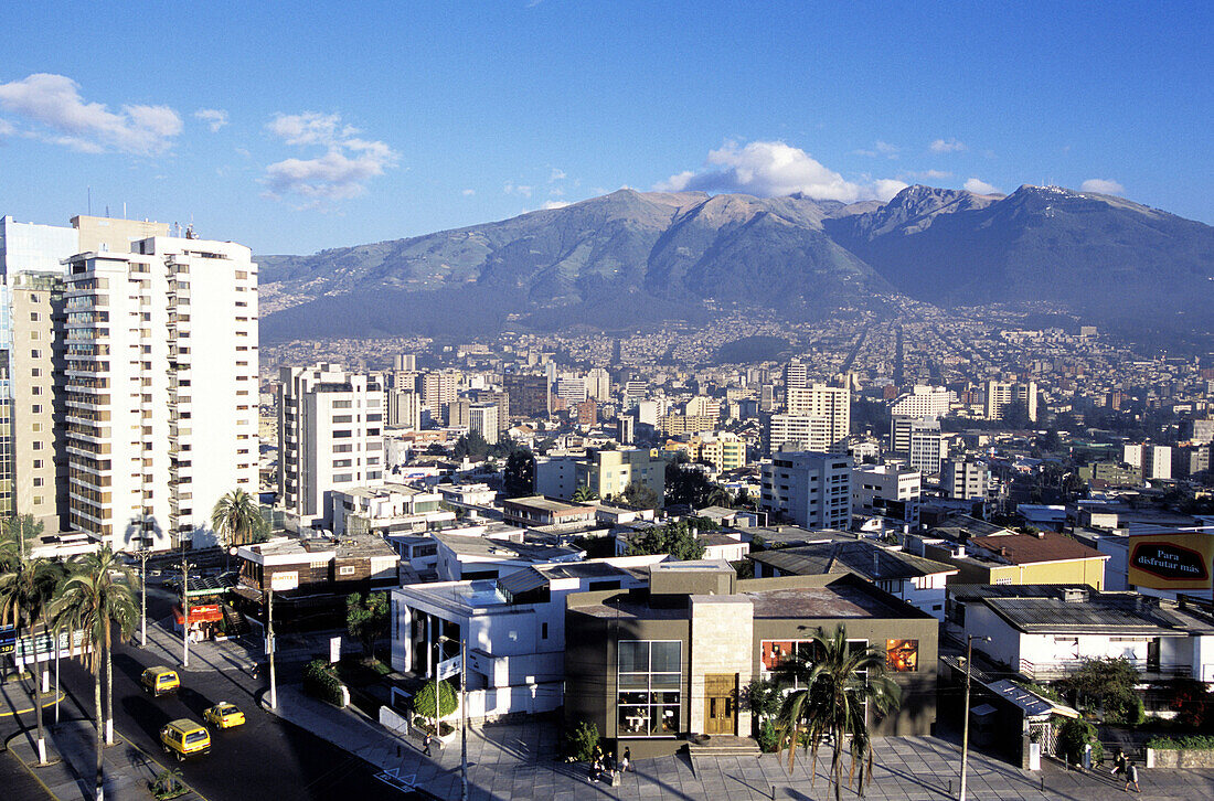 The new town and Rucu Pichincha (4790 m) in background from Hotel Quito terrace. Quito. Ecuador