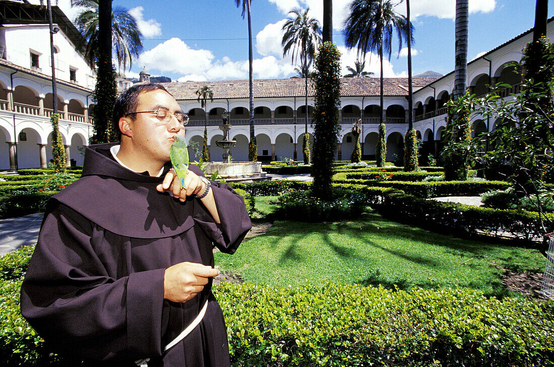 Monk and his parrot pet. Convento de Sant Francisco (Monastery and church founded in 1534 so that the oldest in Latin America). Quito. Ecuador