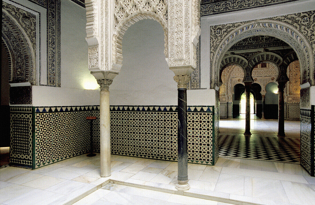 Almohad style rooms and courtyards of the Alcázar palace. Sevilla, Spain