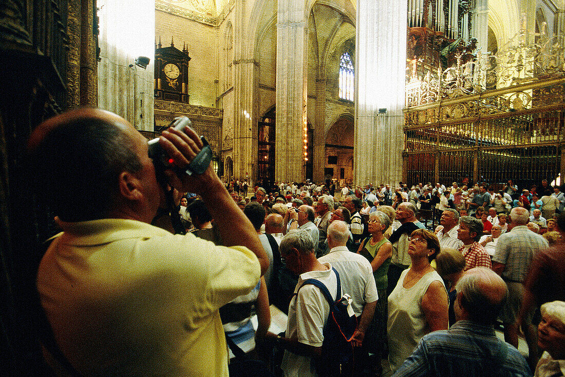 Tourists in the cathedral. Sevilla, Spain