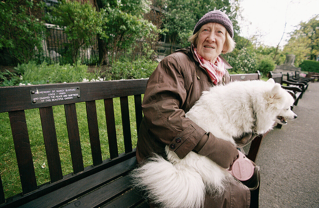 Woman with dog at Hyde Park in spring. London. England