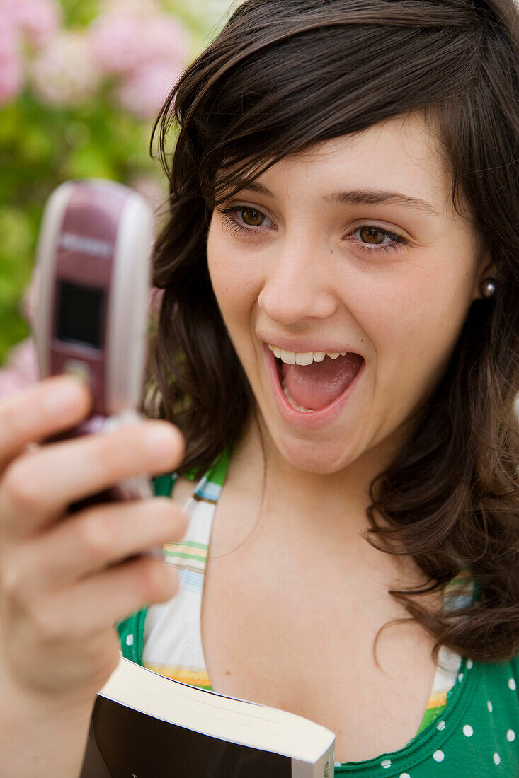 Seventeen year old girl reading a message