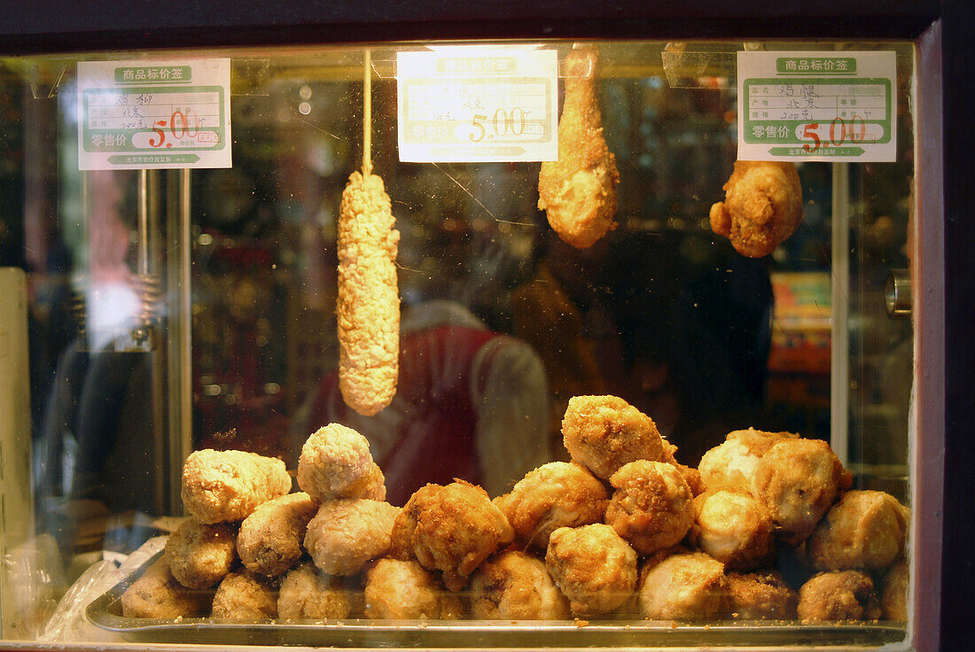 Fried chicken at stall. Beijing, China