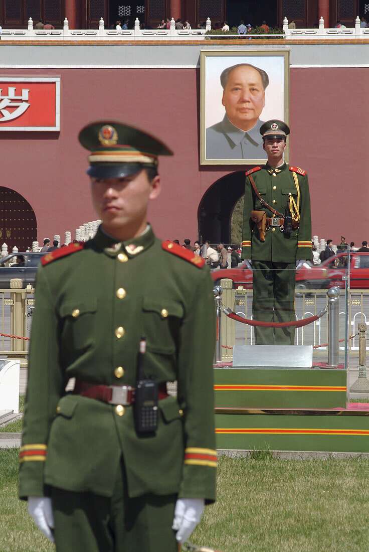 Soldiers stand guard in front of Gate of Heavenly Peace to the Forbbiden City, Tiananmen Square. Beijing. China