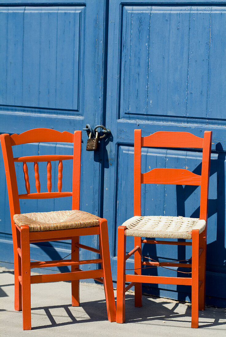 Santorini, Greece, two chairs in the village of Oia.