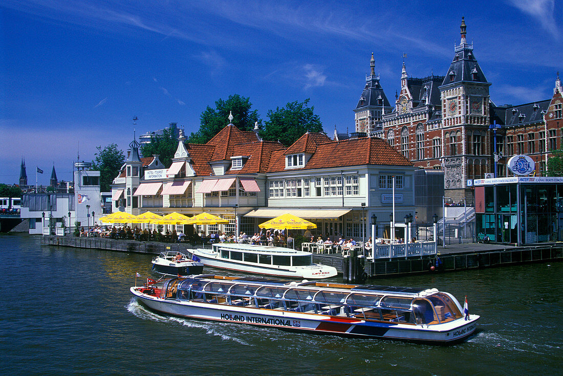 Canal tour boats, Centraal station, Amsterdam, holland.