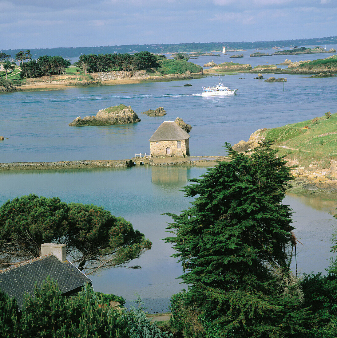 Brehat island. Birlot Tide Mill and cruise boat. Bretagne. France