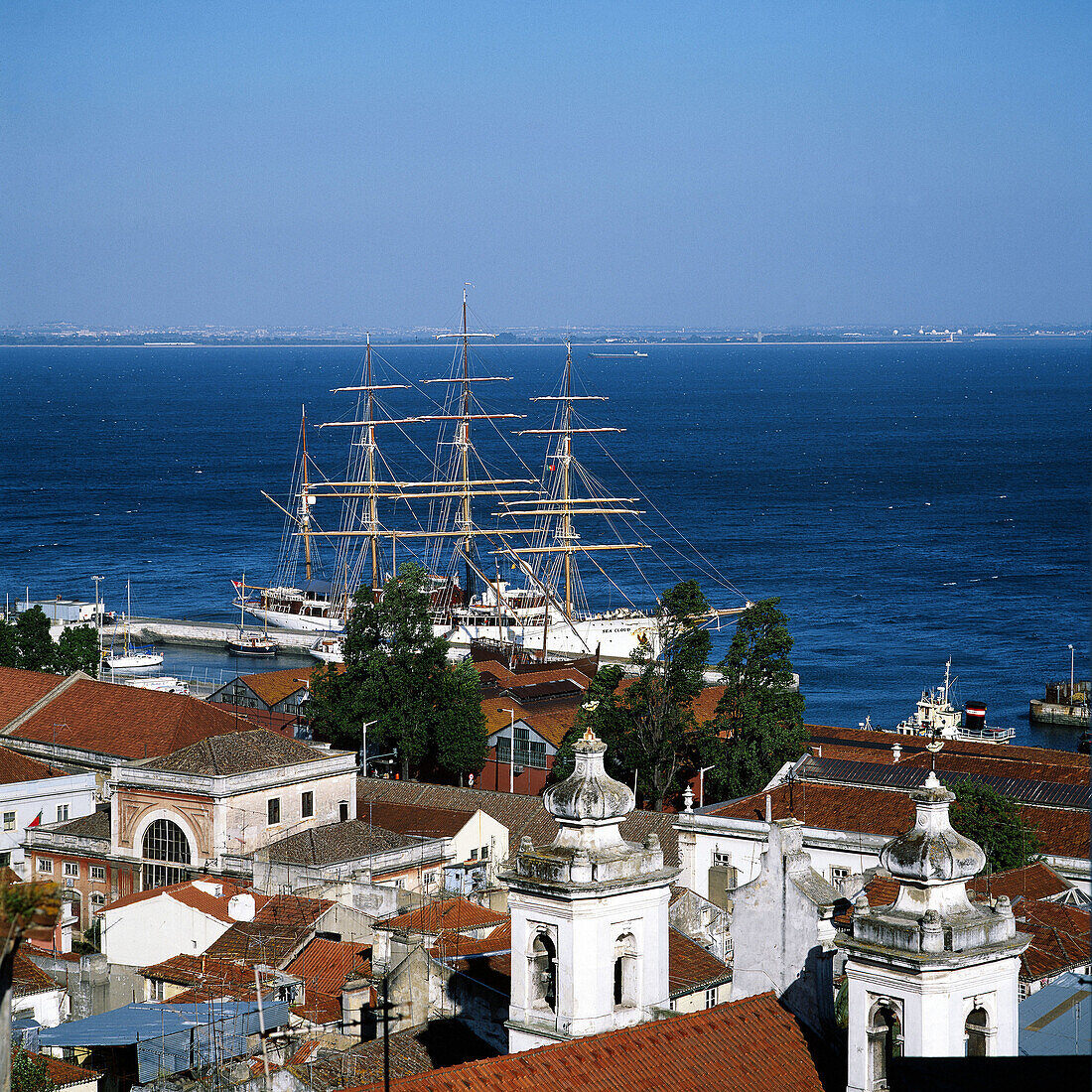 View on Alfama quarter with sailboat and Tejo river from Miradouro Santa Luzia, Lisbon. Portugal