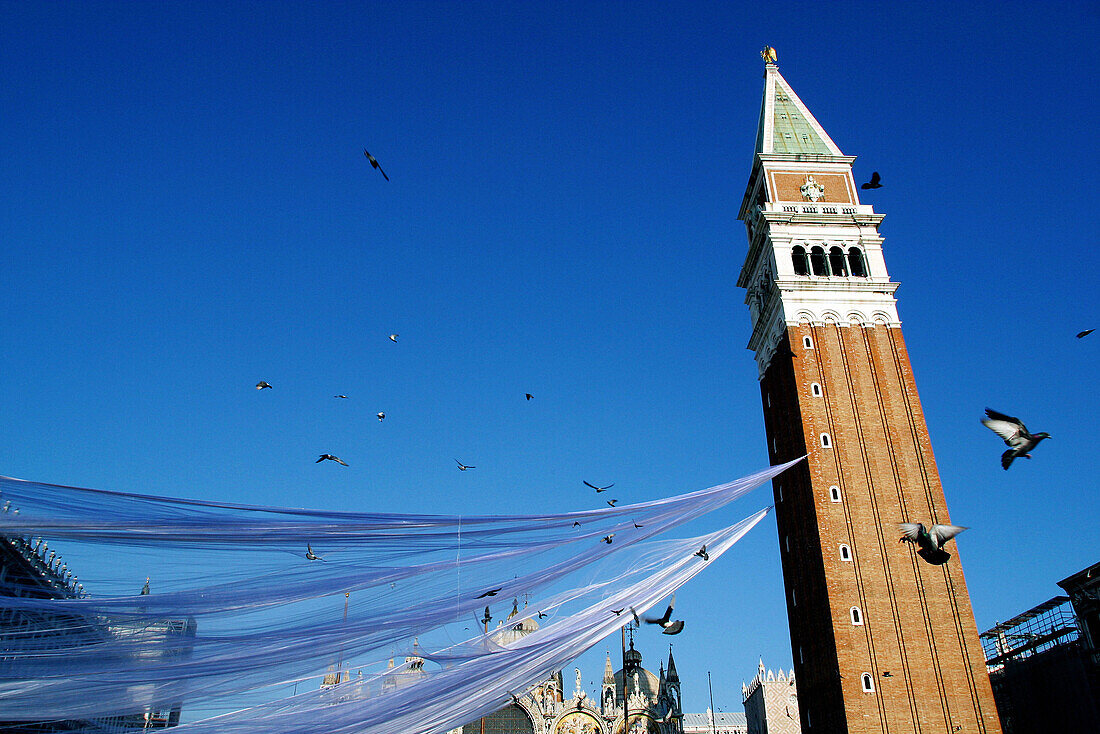 Carnival, campanile (bell tower) at St. Mark s Square. Venice. Italy