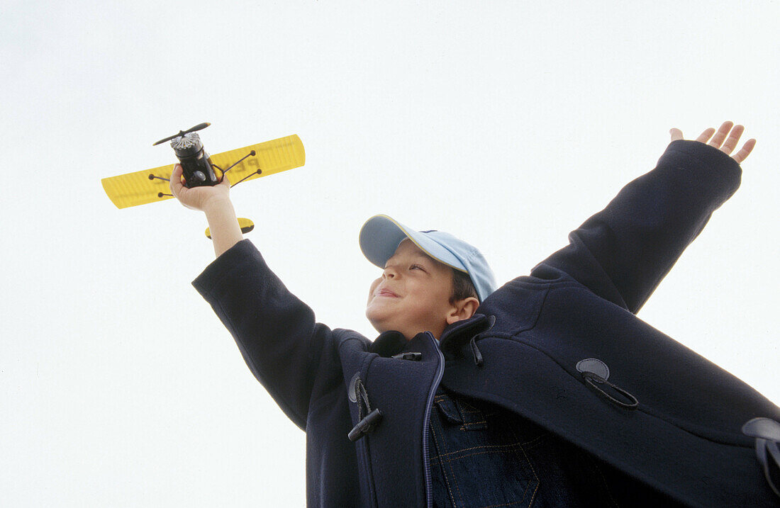 rafts, Airplane, Airplanes, Boy, Boys, Cap, Caps, Carefree, Caucasian, Child, Childhood, Children, Color, Colour, Contemporary, Daytime, Exterior, Flight, Flights, Fly, Flying, Grin, Grinning, Happine