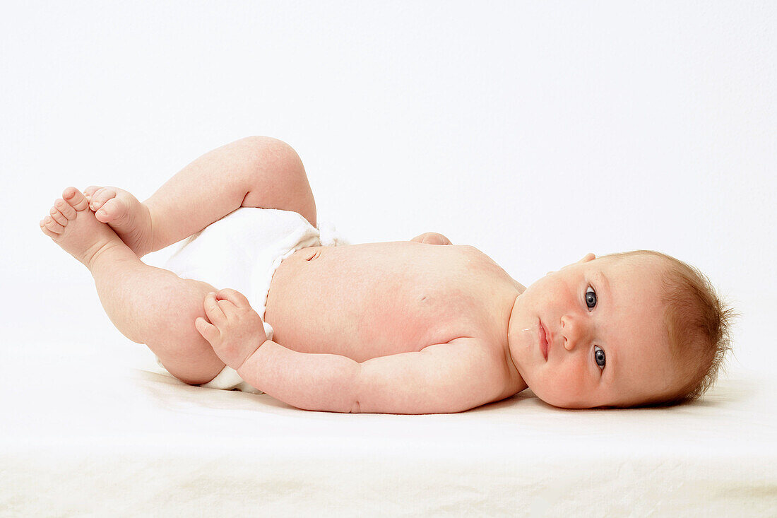 Baby Lying Down Looking at Camera