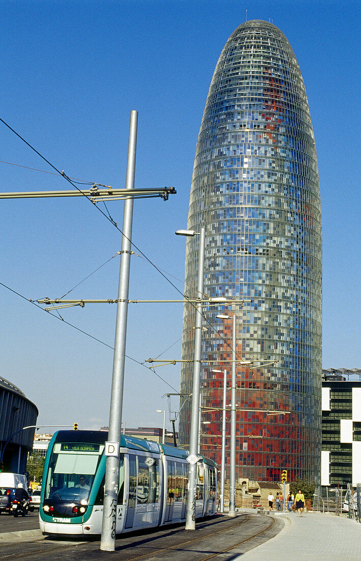 Agbar Tower (142 m. ) by Jean Nouvel and tram, Plaça de les Glòries, Barcelona. Catalonia, Spain
