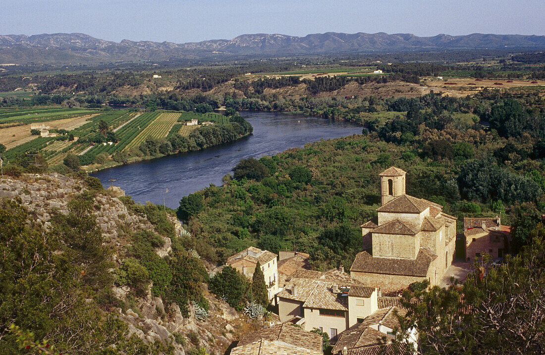 Overview of Miravet parish church and Ebre rive from Templar castle. Tarragona province. Catalunya. Spain