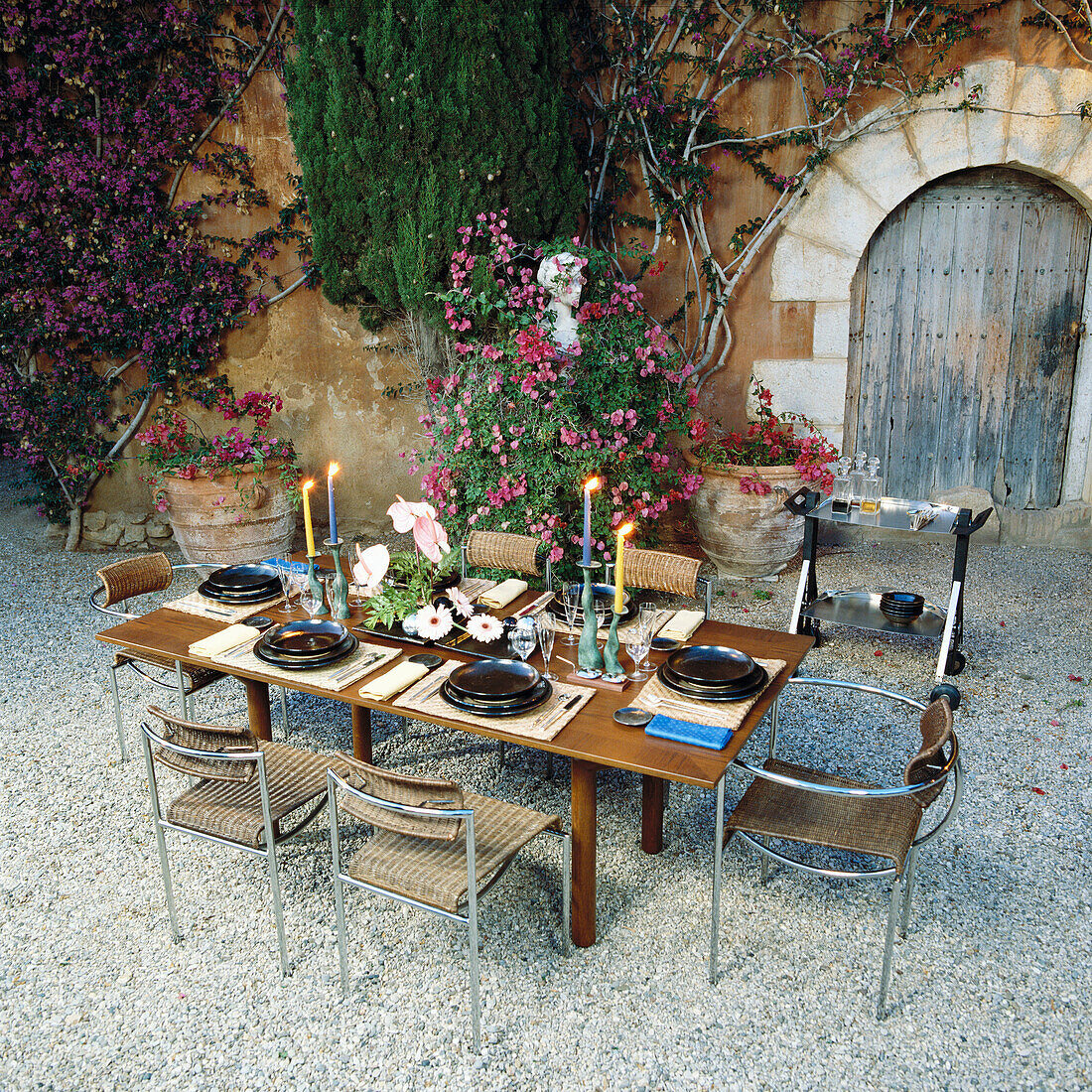 Table and chairs in a courtyard.