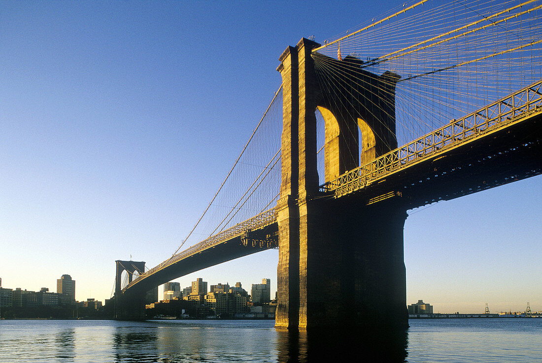 Brooklyn Bridge and downtown. East River, Brooklyn, New York City. USA