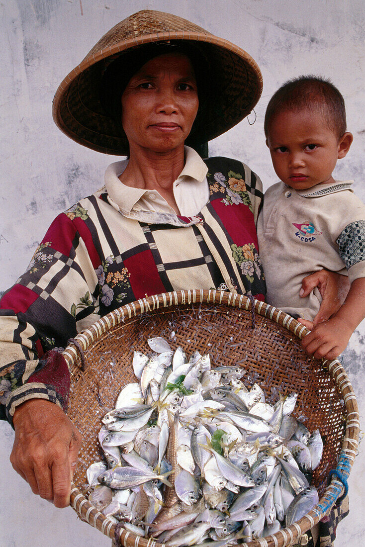 Woman and child. Pangandaran. Java. Indonesia