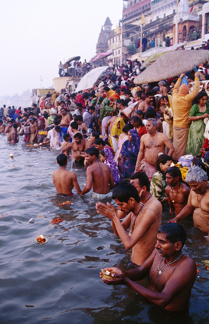 The Ganges. People bathing on the ghats on the day of Makar Sankranti. Varanasi. India.