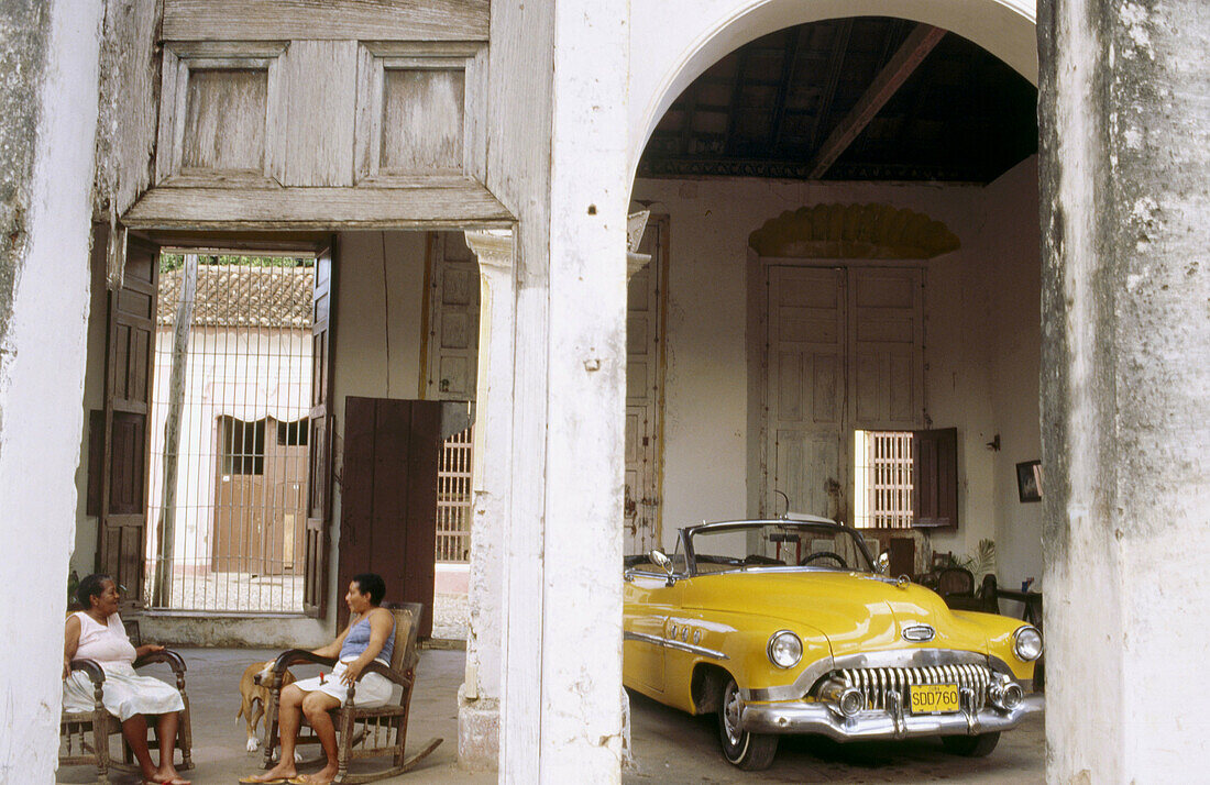 House and classic car. Trinidad, Cuba.
