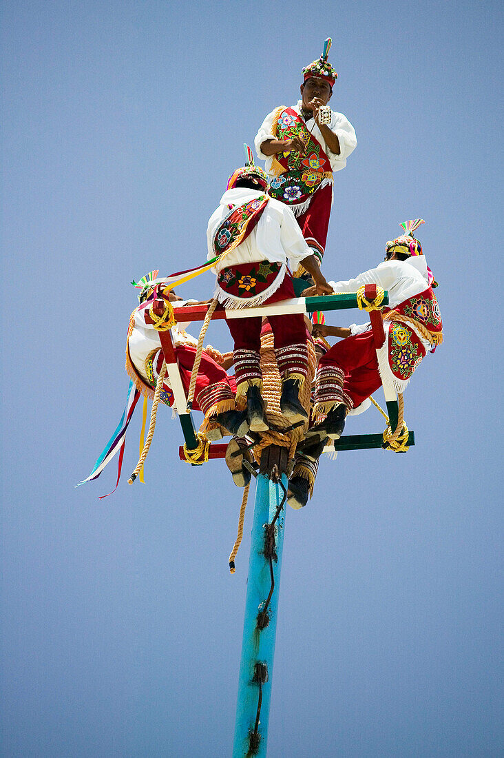 Voladores (flyers) perform Totonac Native ritual outside of Tulum. Yucatan, Mexico