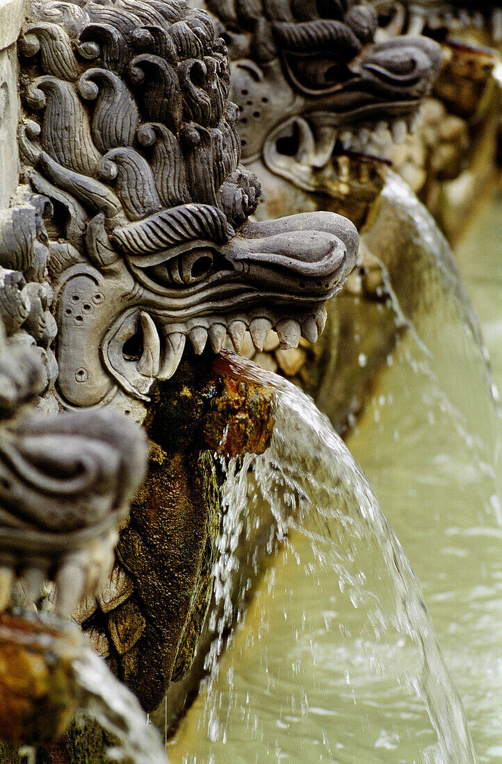 Air Panas Banjar hot springs, carved stone nagas (mythical snakelike creatures). Bali Island, Indonesia