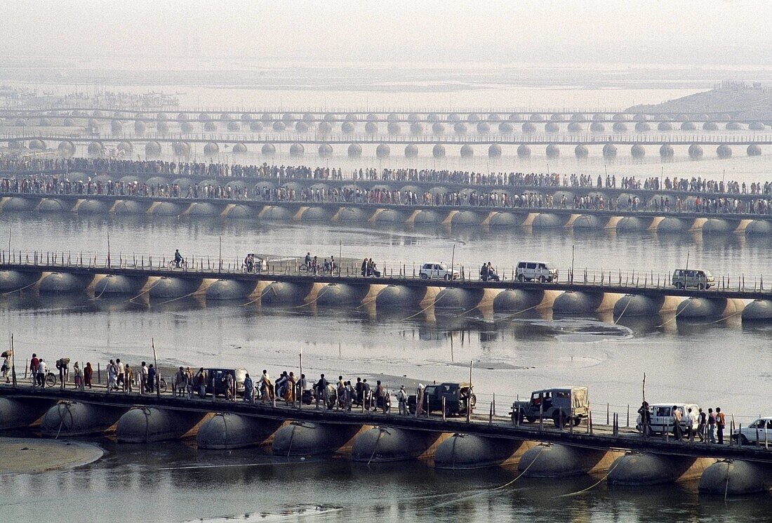 Pilgrims crossing the Ganges at Kumbh Mela Festival. Allahabad, Uttar Pradesh, India