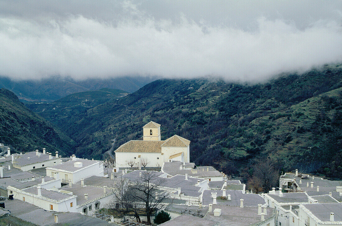 Bubión village above Poqueira gorge in the Alpujarras mountains with its typical grey launa (a special type of clay found in this area) roofs. Granada province, Andalusia, Spain