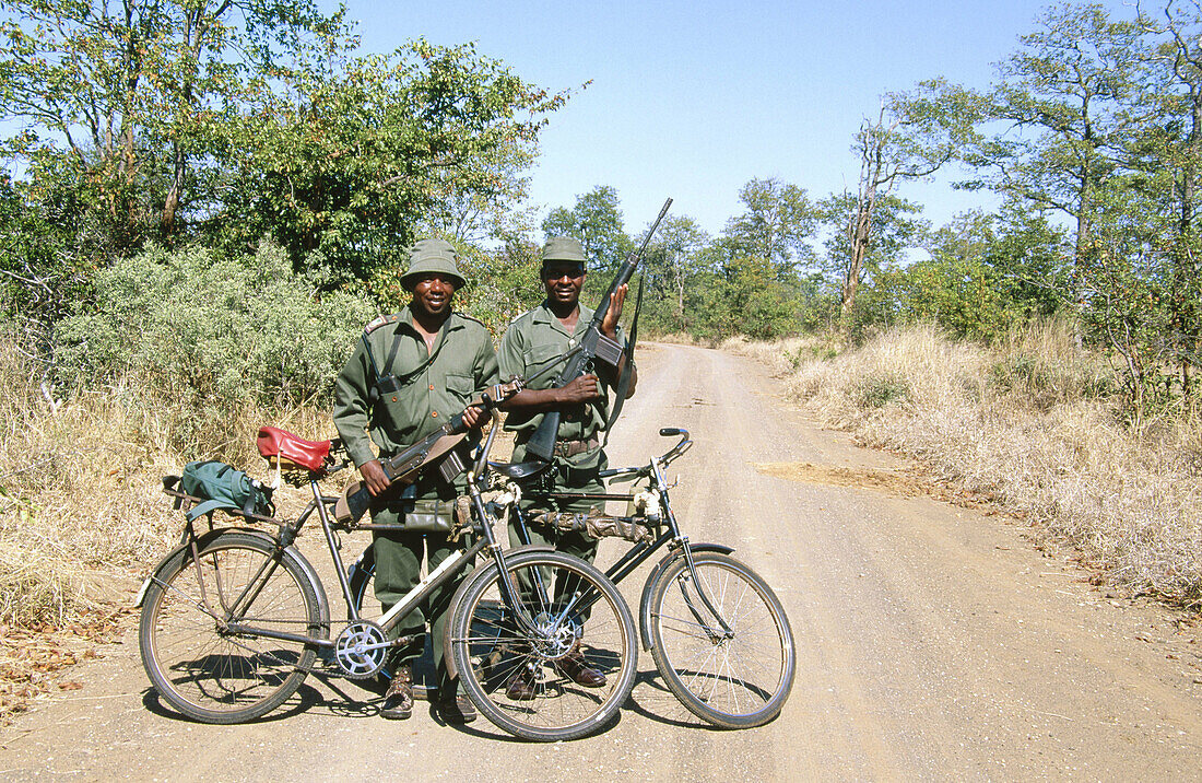 Rangers patrolling the park on bicycles. Kruger National Park. South Africa