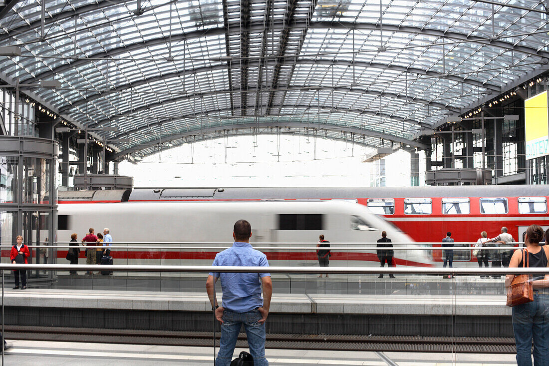 Trains passing central station, Berlin, Germany