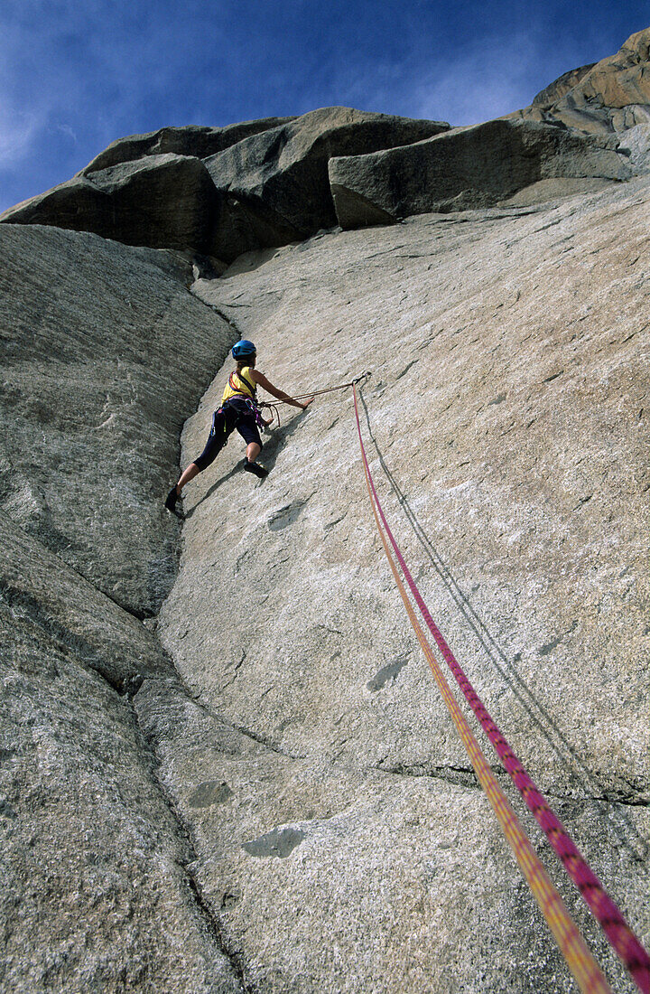 young woman climbing a dihedral at Gross Furkahorn, Urner range, Uri, Switzerland