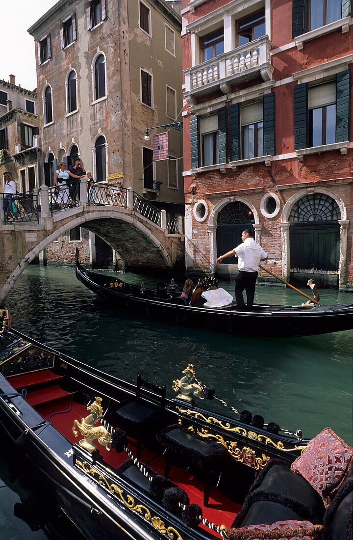 Canal with bridge and boats (gondolas), Venice, Venezia, Italy