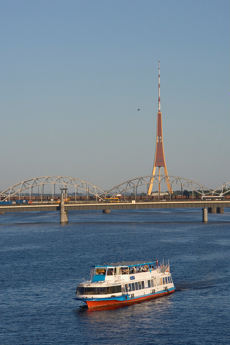 Cruise-ship on river Daugava and the radioantenna of Riga