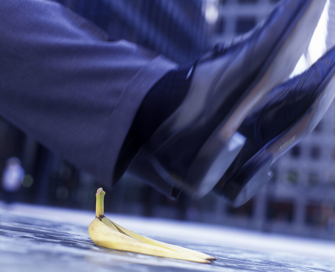 Office worker slips on banana peel.