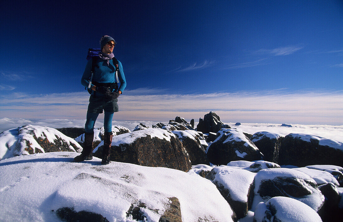 Hiker on top of Mt. Ossa, Cradle Mountain Lake St. Clair National Park, Tasmania, Australia