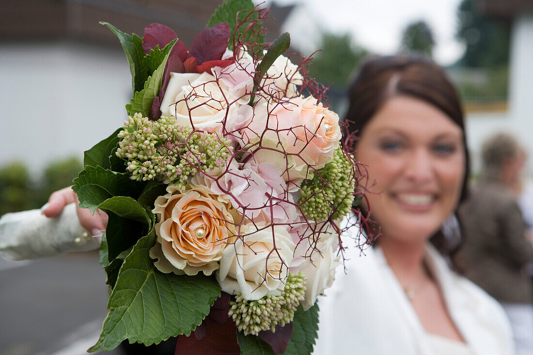 Bride with bridal bouquet, Hauneck, Hesse, Germany