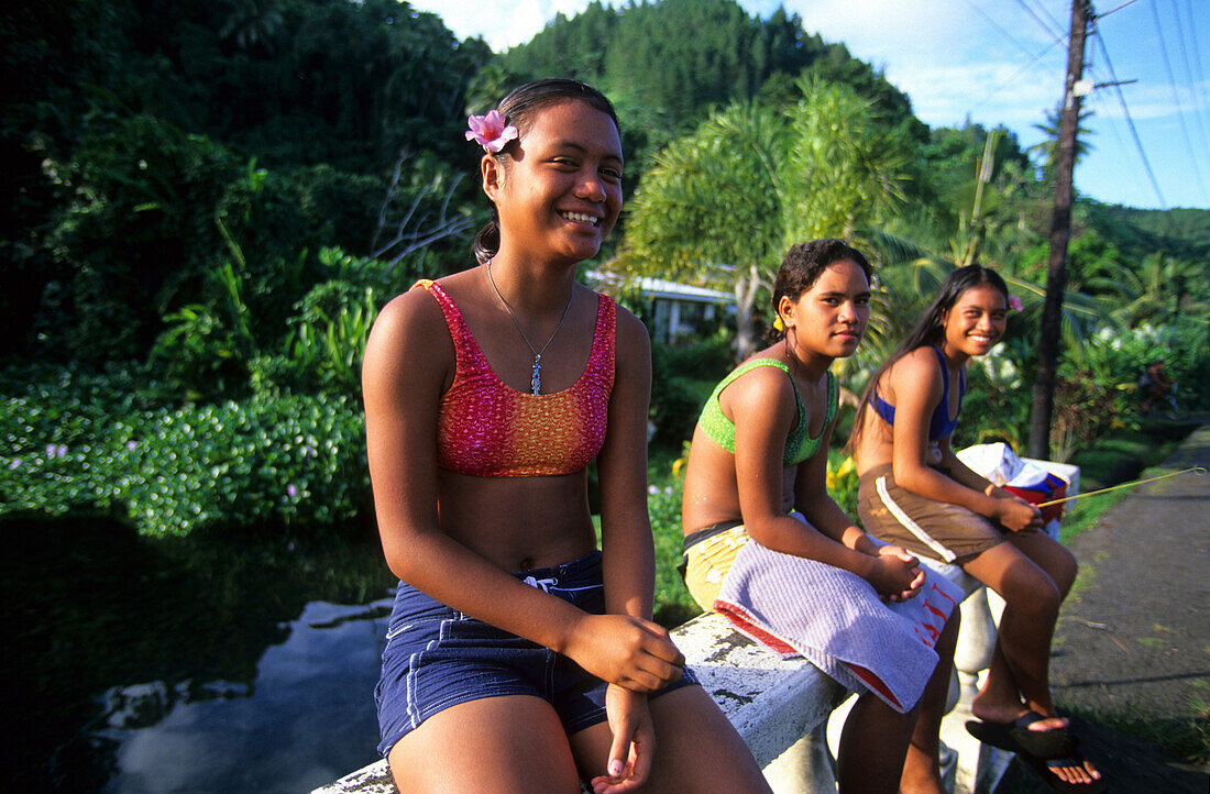 Three local girls along the coast road, Tahiti, French Polynesia, south sea