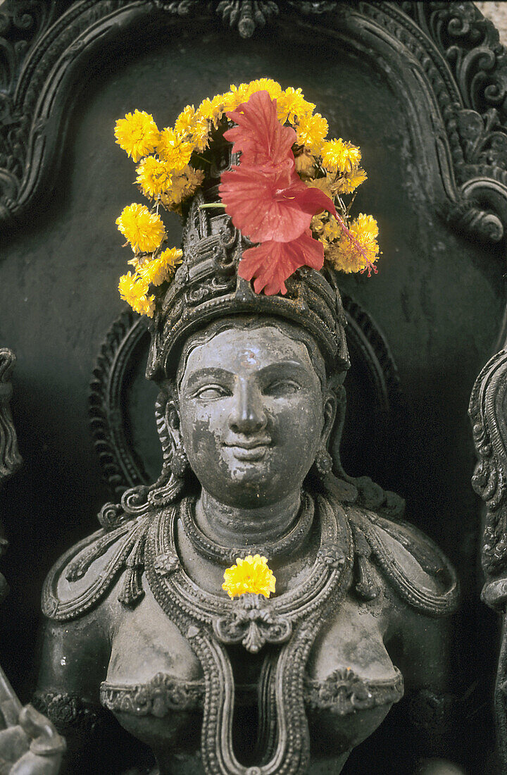 Heavenly nymph with flower offerings, India
